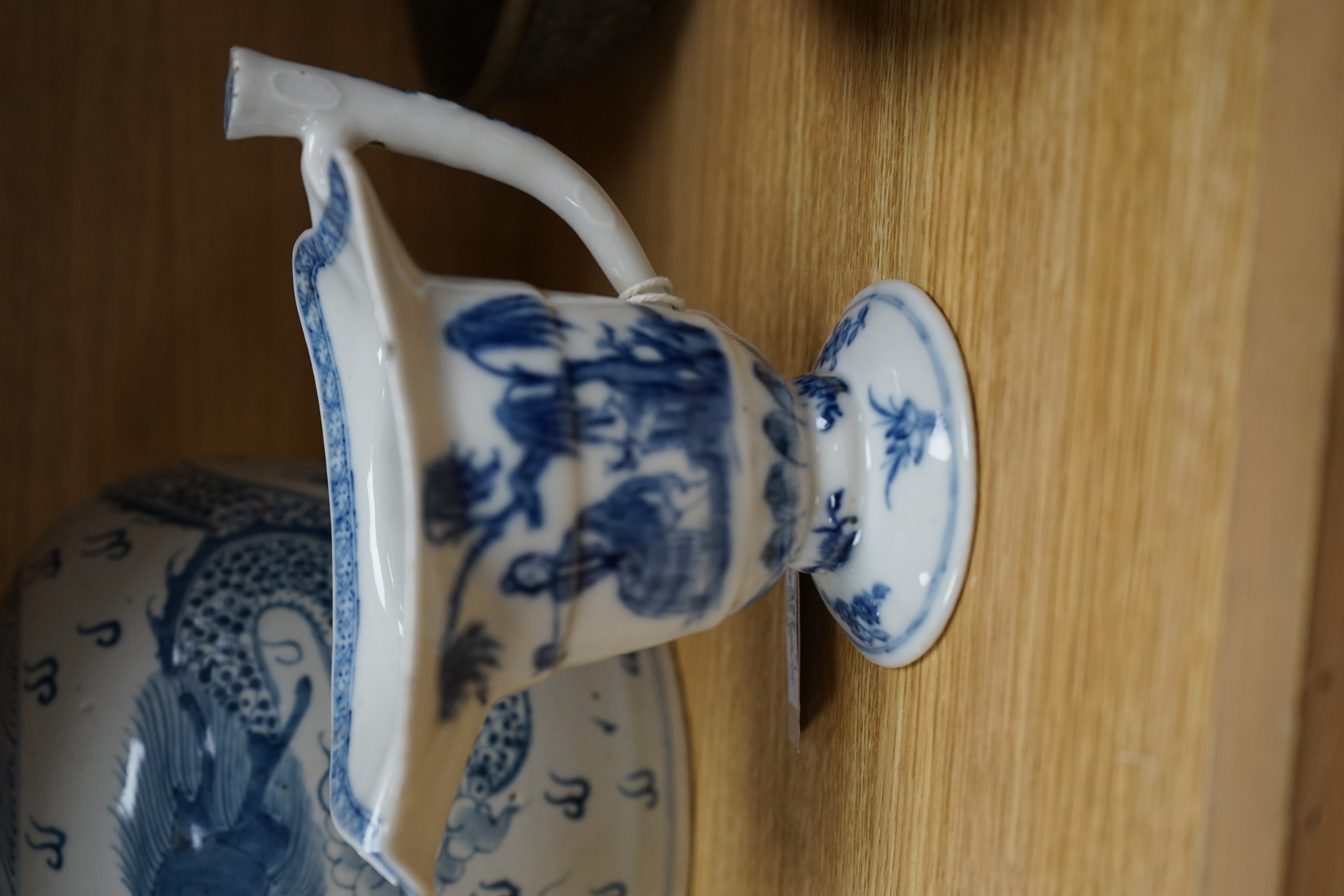 A Chinese blue and white jar, 20cm and a helmet shaped jug, 18th century and later